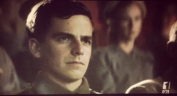 Justin Hannan on screen in period costume in Parer's War